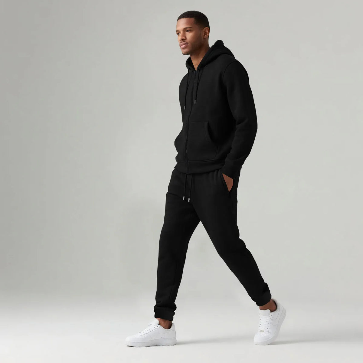 Men's hooded sportswear set in black with long sleeve jacket and long pants, cotton-polyester blend.