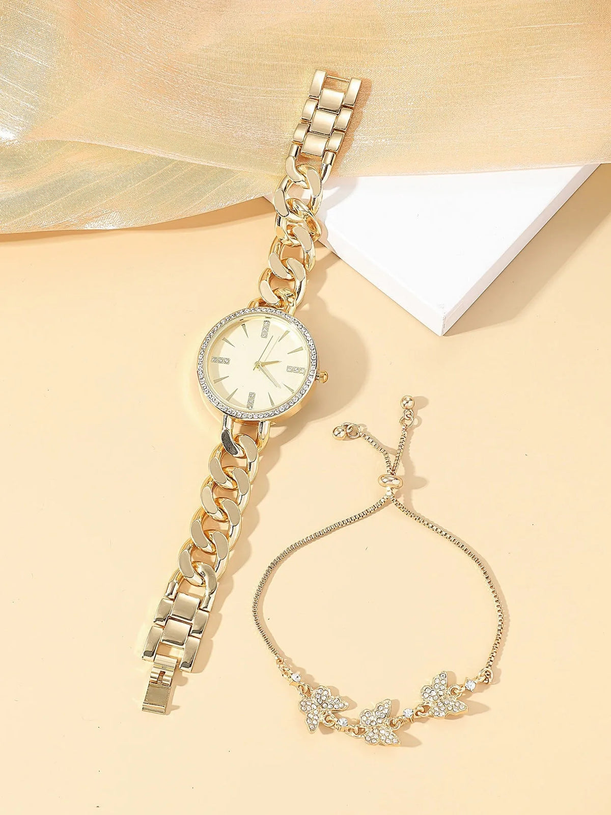 Women's wrist watch with thin alloy strap, circular dial, and titanium metal jewellery buckle