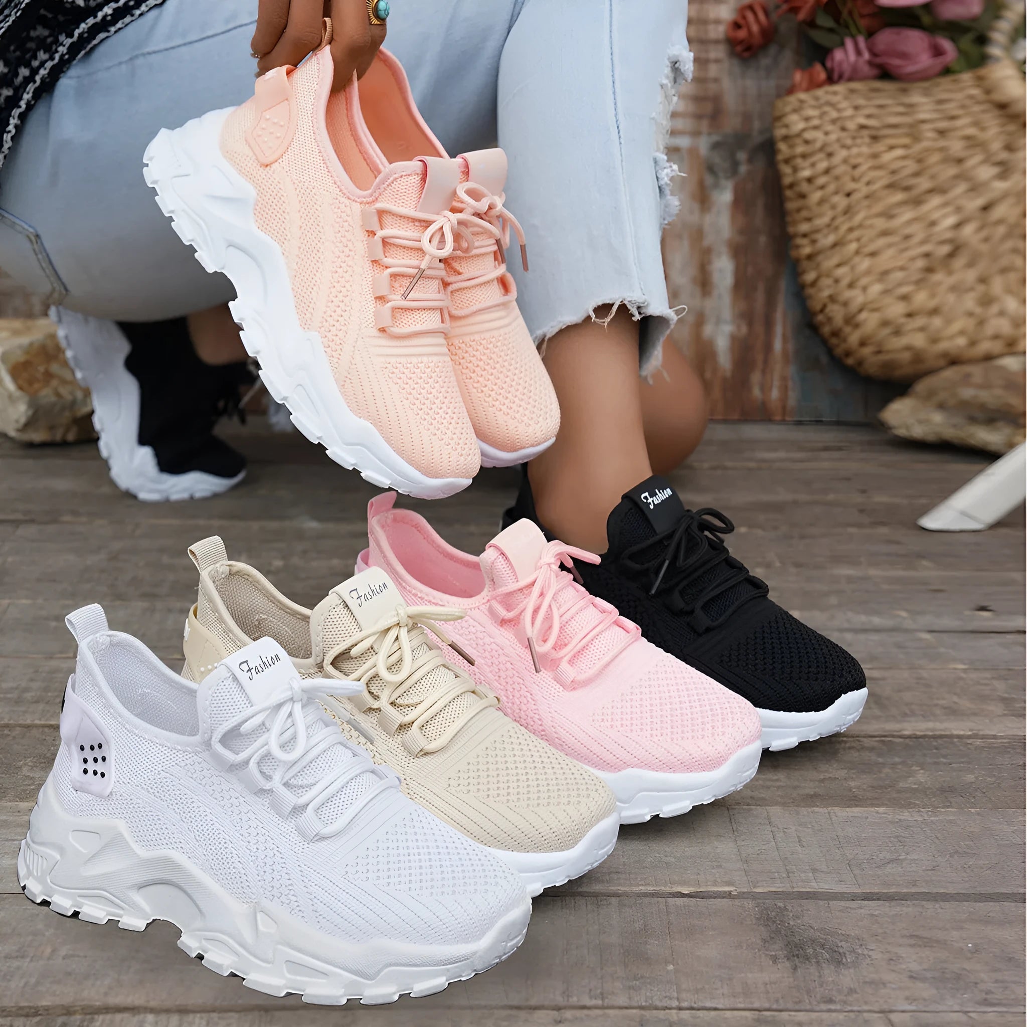 Women's Flyknit mesh casual trainer in multiple colours on a white background, showing lace-up front and round toe design