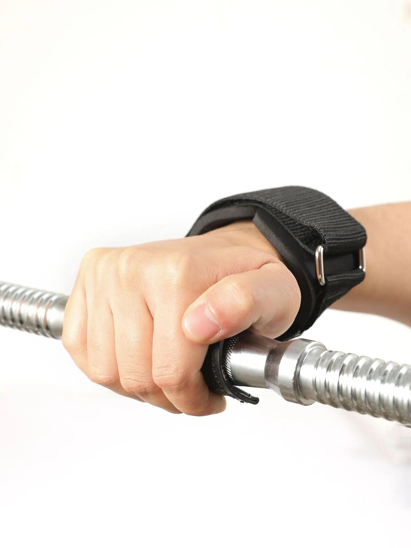 Black rubber palm protector with an assist strap for weightlifting and rock climbing.