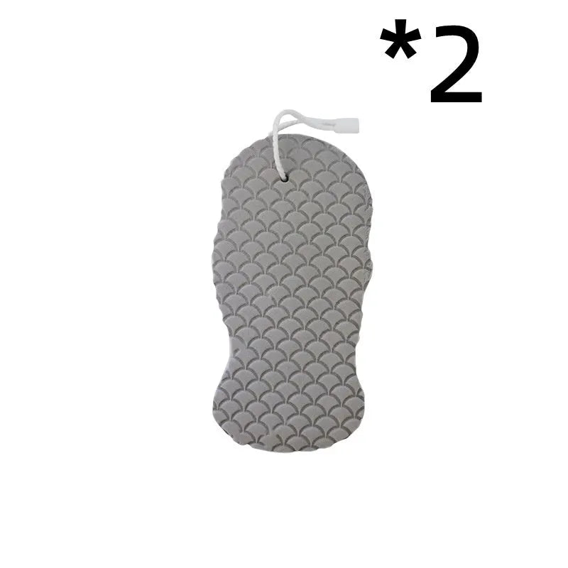 White 3D fish scale pattern bath sponge with hang loop on a bathroom background.