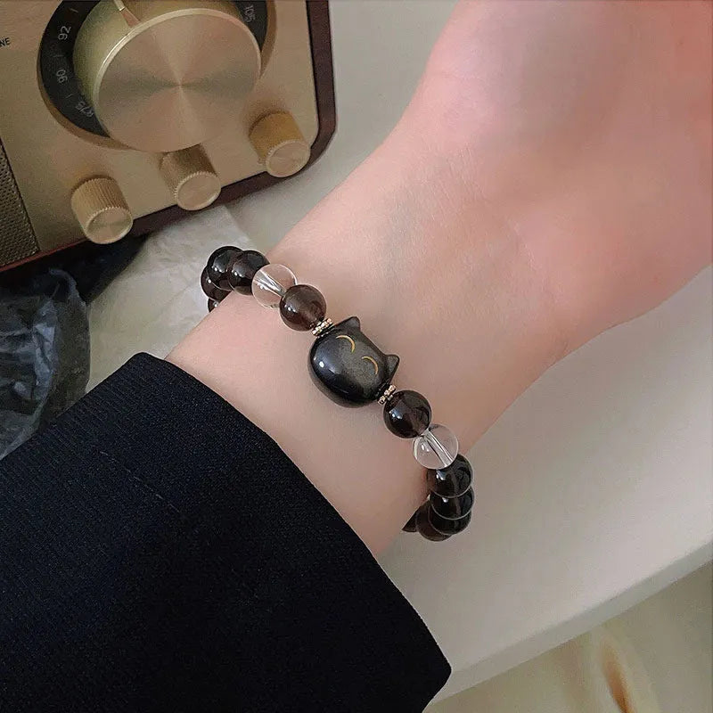 Women's silver tone bracelet with 8mm ice stone opal cat head charm and adjustable chain