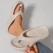 Women's black thick-soled EVA flip-flops with a non-slip sole pattern