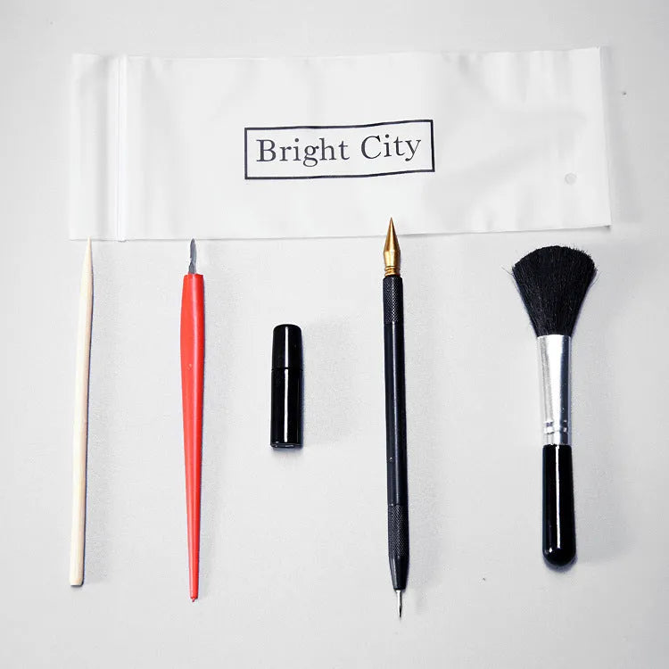 Scratch art tool set with scraper pen, brush, bamboo stick, and repair liquid bottle.
