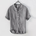 Men's grey linen short sleeve pullover top on a hanger