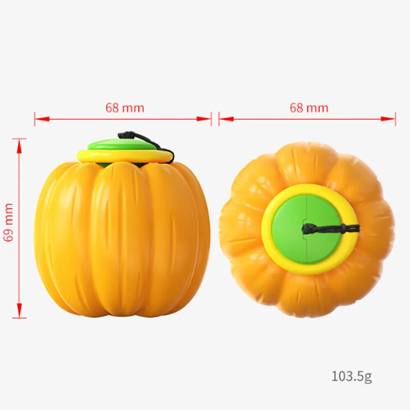 Orange plastic pumpkin-shaped dog toy with squeaker for small dogs on a green background.