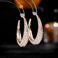 Geometrical women's copper hoop earrings with zirconium accents in five colour choices.