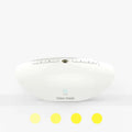 White noise sleep aid machine with mechanical buttons in white finish showing timer and volume controls