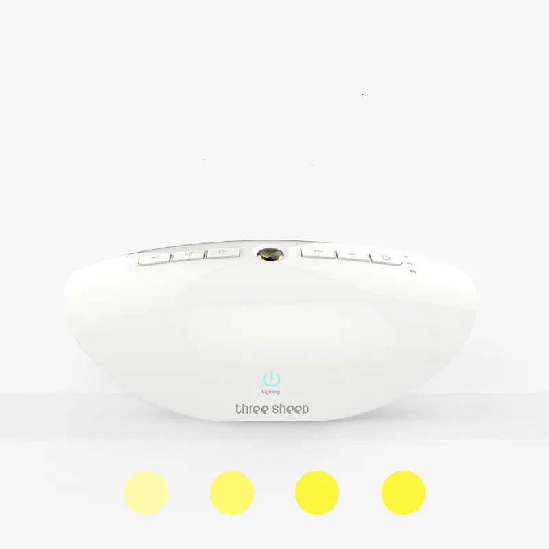 White noise sleep aid machine with mechanical buttons in white finish showing timer and volume controls