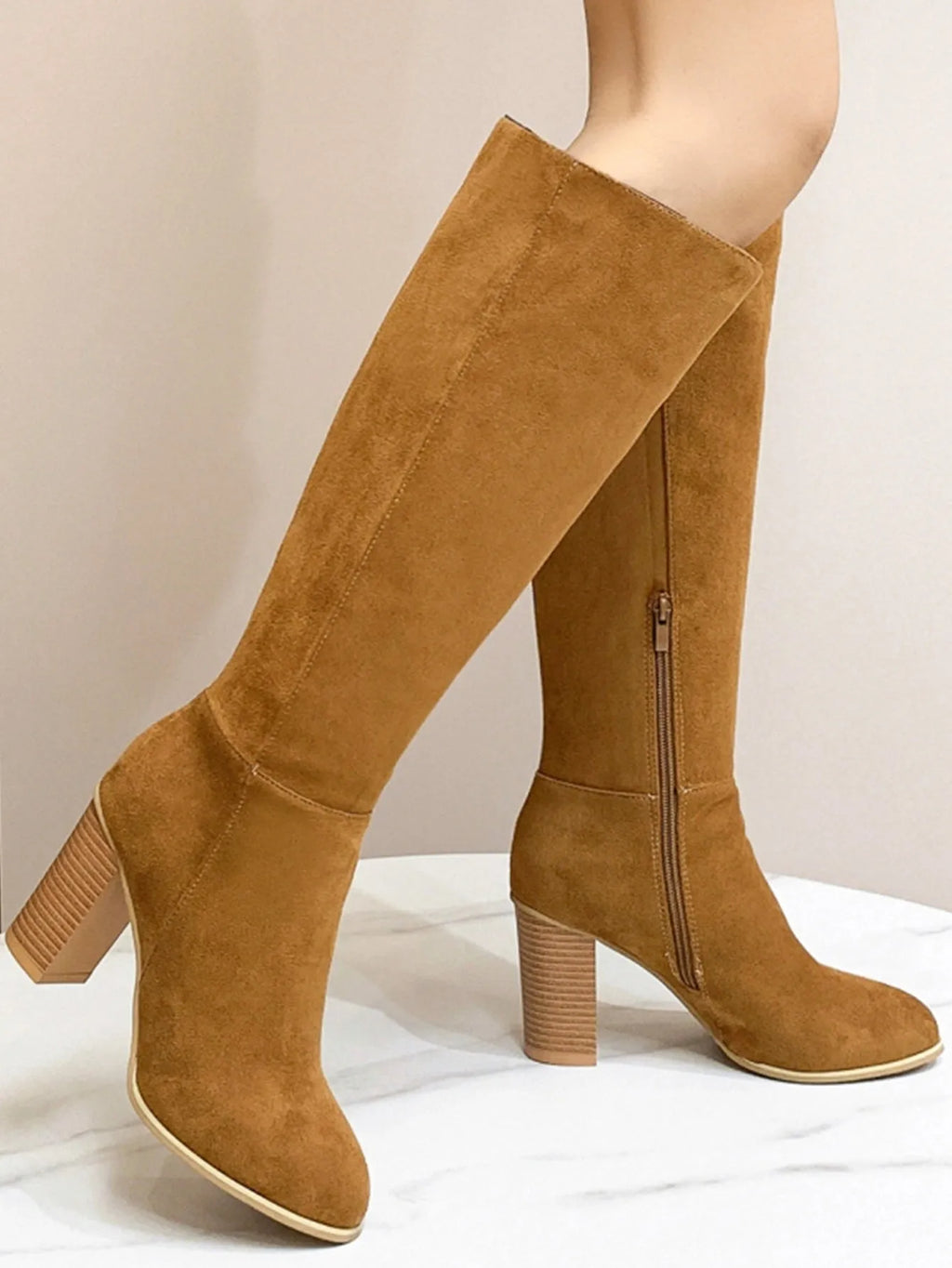 Women's square toe high heel boots in black and dark brown colours, showing artificial PU upper material