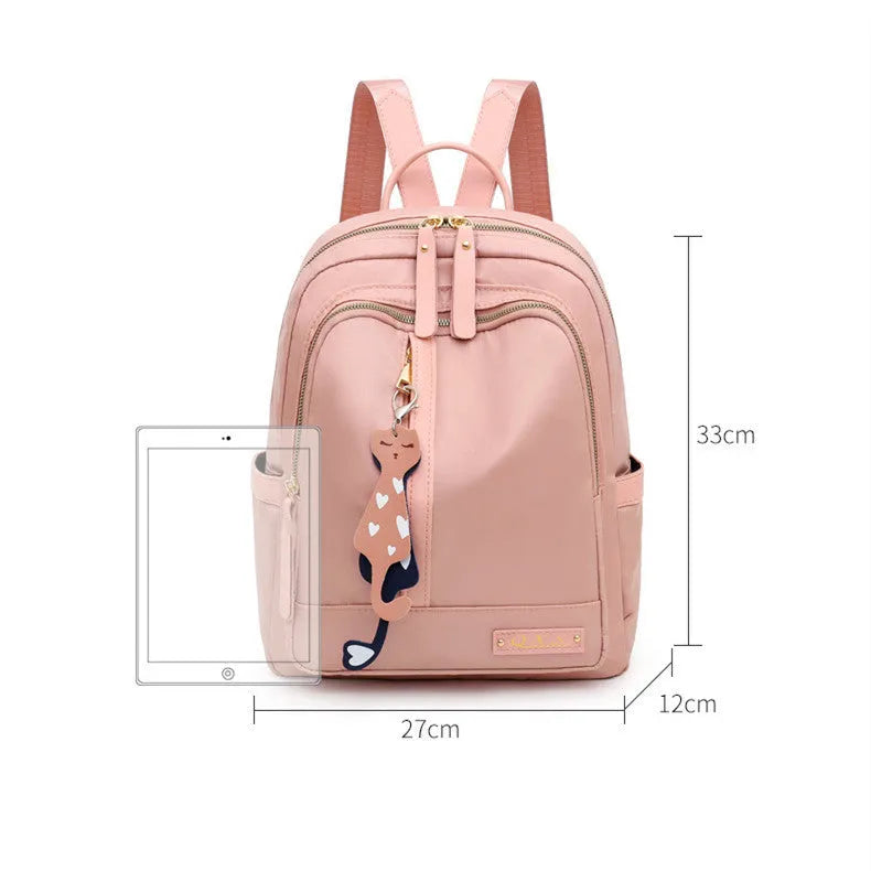 A black soft nylon women's casual travel backpack with double straps and multiple internal compartments.