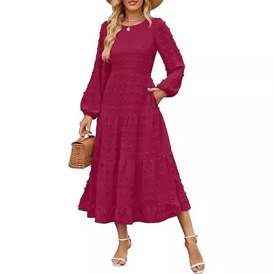 Women's beige long sleeve dress with ruffled sleeves and a high waist, shown on a hanger.