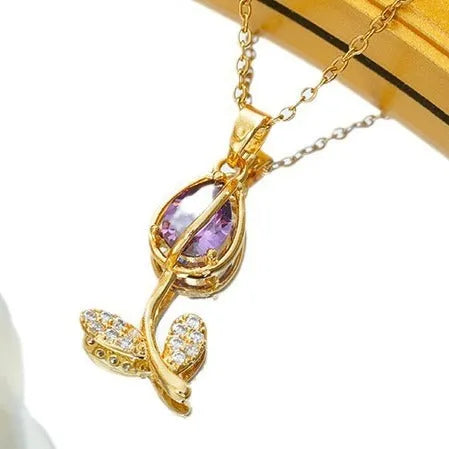 Adjustable gold tulip flower pendant necklace on an O-ring chain, showing colour options.