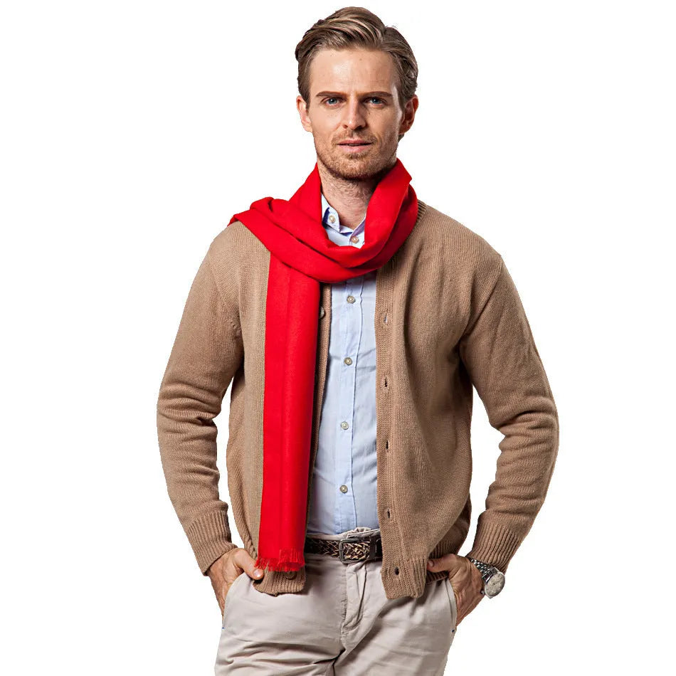 Men's solid red double-sided velvet scarf with tassel ends on a neutral background
