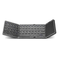Three folding wireless Bluetooth keyboard with touch pad in black, unfolded on a desk