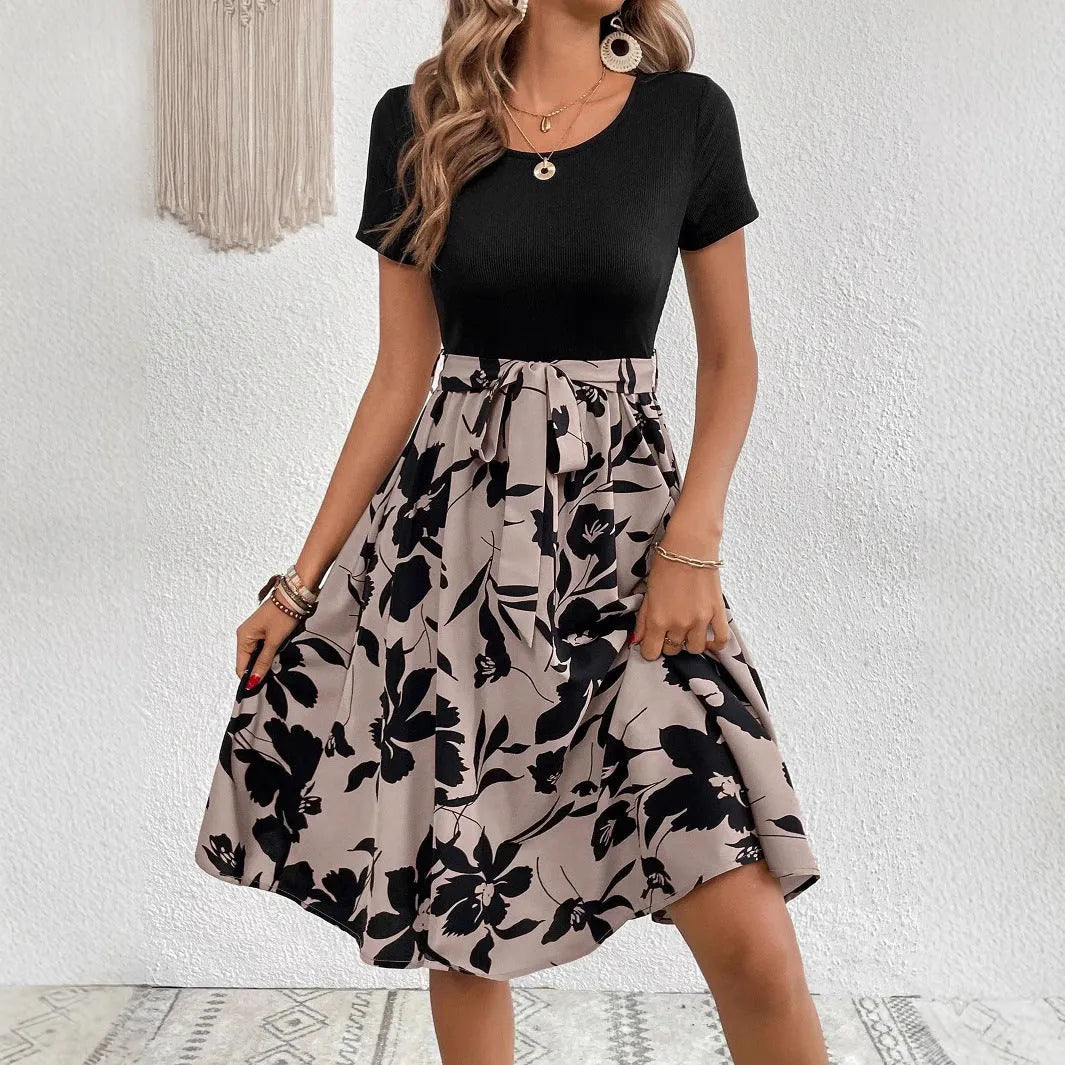 Women's khaki A-line dress with printed floral pattern and lace-up shoulder detail.