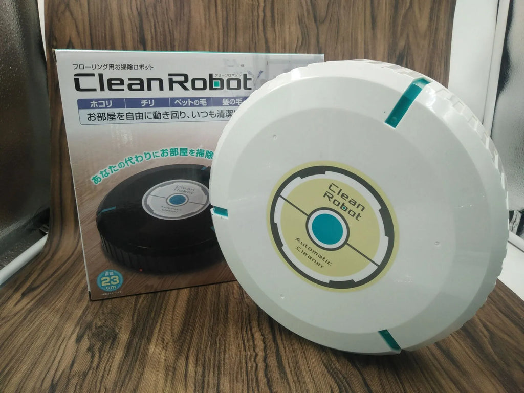 Black and white automatic robot vacuum cleaner on a wooden floor.