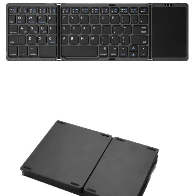 Three folding wireless Bluetooth keyboard with touch pad in black, unfolded on a desk