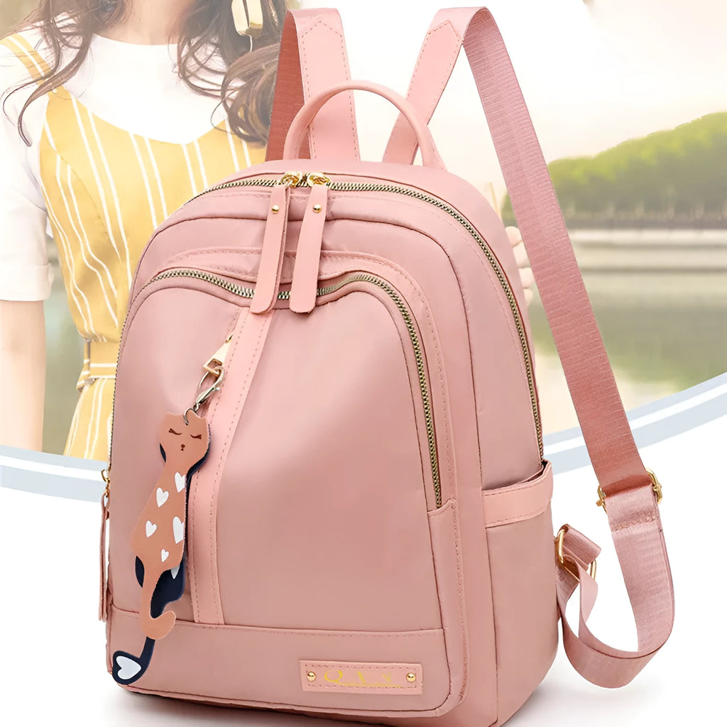 A black soft nylon women's casual travel backpack with double straps and multiple internal compartments.