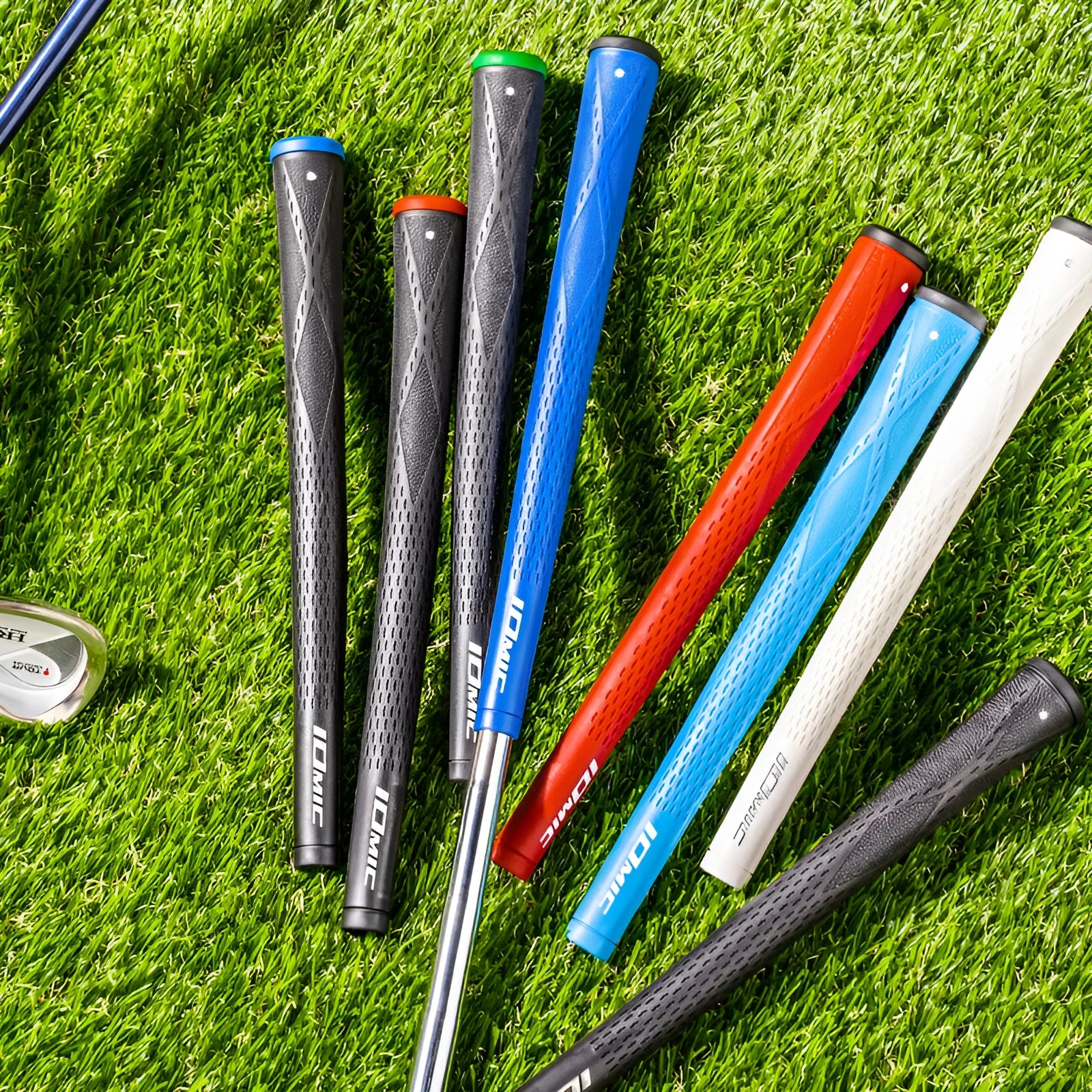 Single TPE golf club grip in red colour, showing textured non-slip surface and tapered shape.