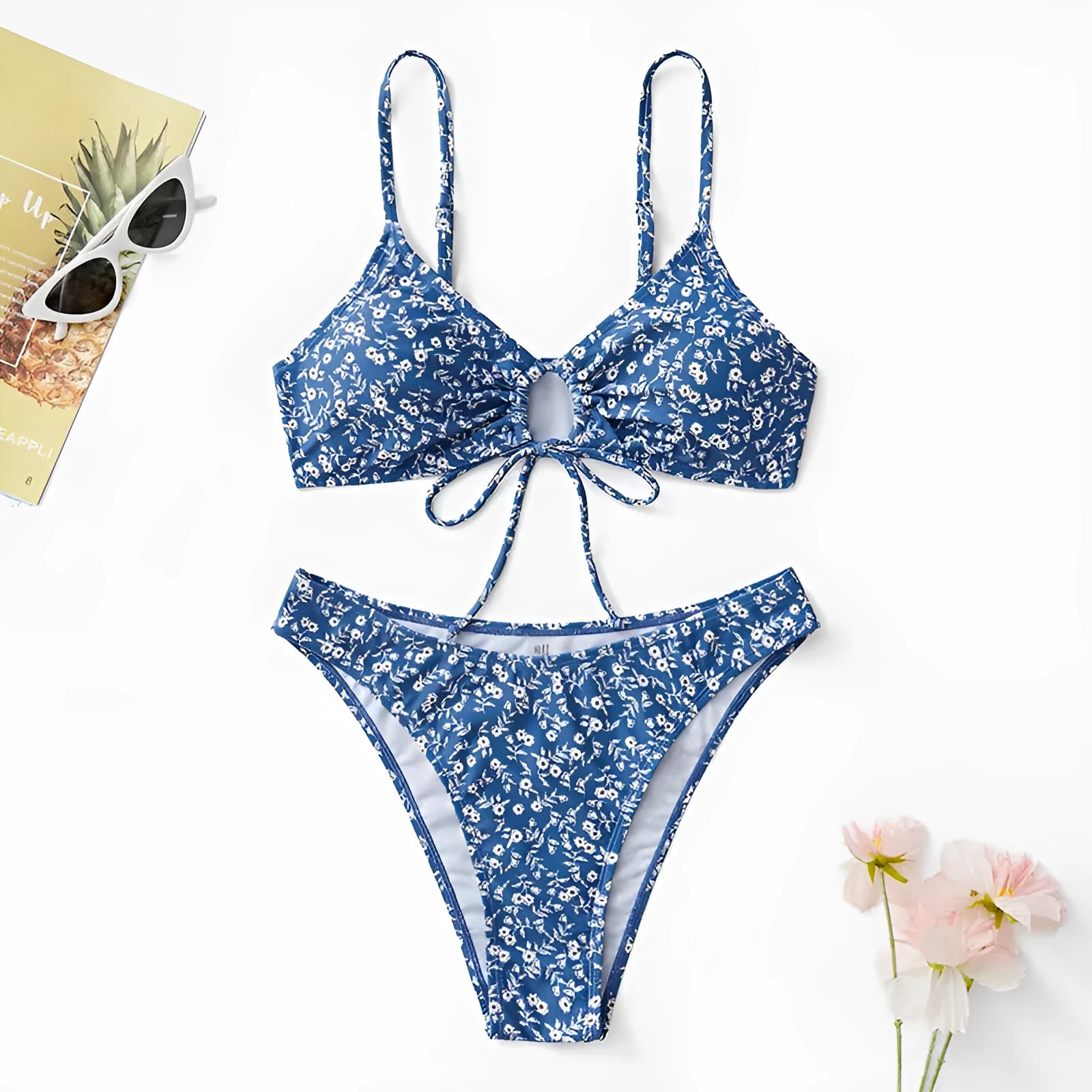 Blue polyester three-piece swimsuit set for women, featuring a halter top and boy short bottoms.