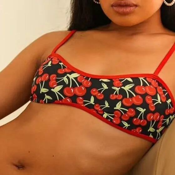 Women's cherry print floral bikini swimsuit with tube top and briefs.