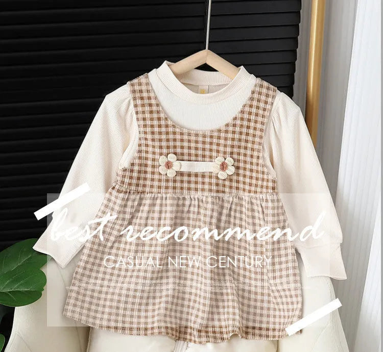 Baby girl wearing a dark coffee plaid Korean style long-sleeved dress suit set, comprising a shirt and dress.