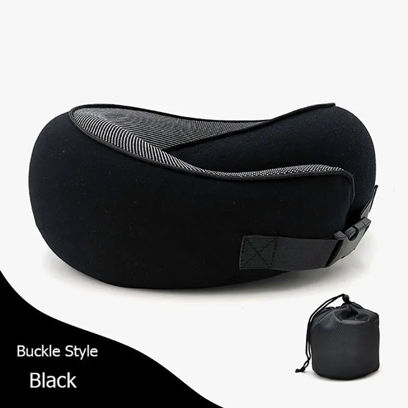 Navy blue memory foam U-shaped travel neck pillow rolled up next to its carry bag