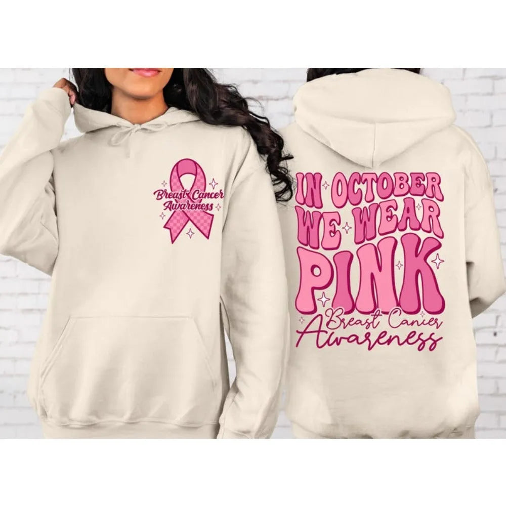 Women's pink pullover hoodie with a retro Breast Cancer Awareness print and side seam pockets.