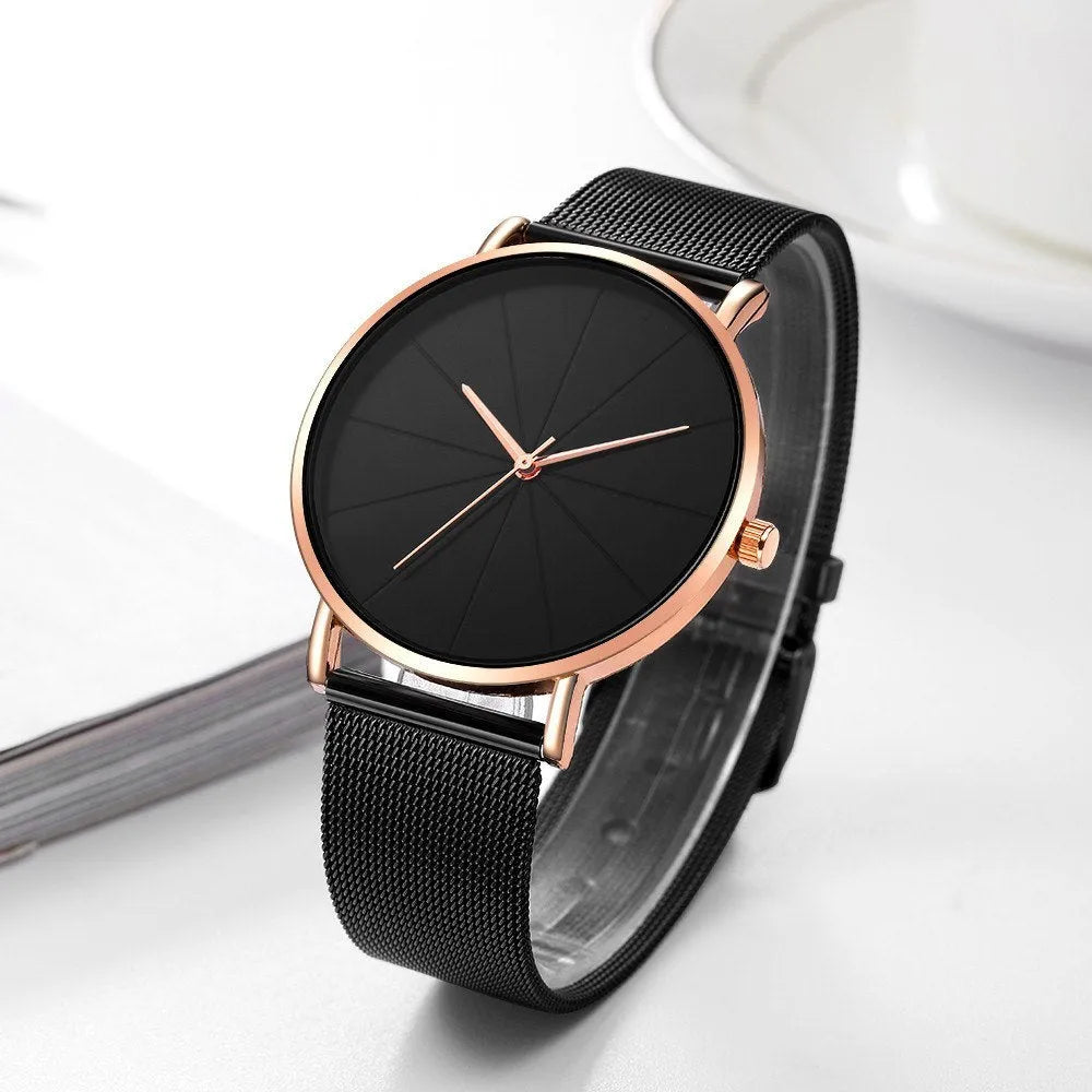 Stainless steel men's quartz watch with round dial, date window, and adjustable pin buckle on a white background.