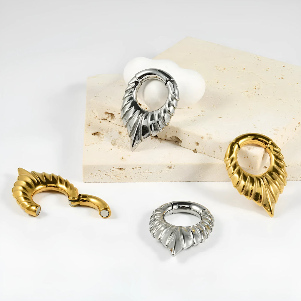 Drop-shaped stainless steel ear extender with etched totem design for cartilage piercing stretching
