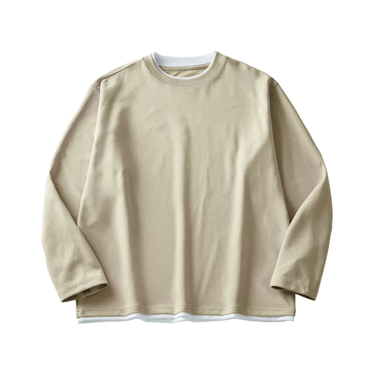 Man wearing a loose-fit long-sleeved cotton blend t-shirt in a solid colour, showing the round neck and casual style.