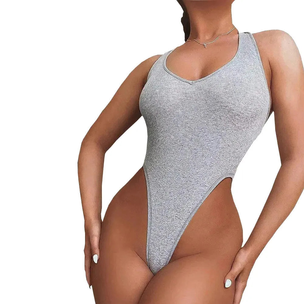 Grey women's halter neck jumpsuit with suspenders vest design and shorts.