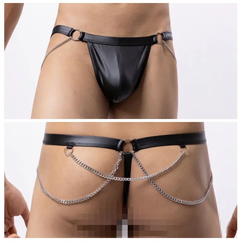 Black patent leather men's thong shorts with a metal chain pack detail on the front.