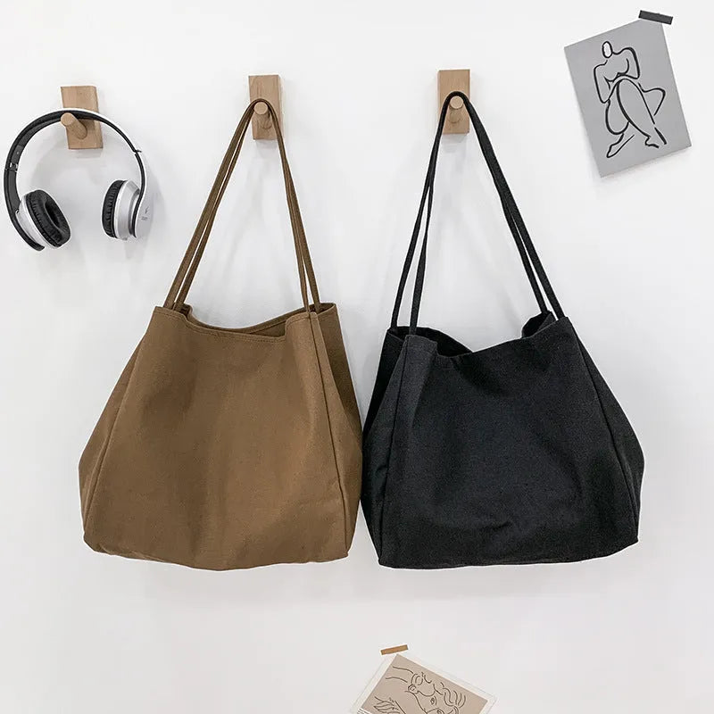 Solid colour women's canvas handbag with double shoulder straps and mobile phone compartment