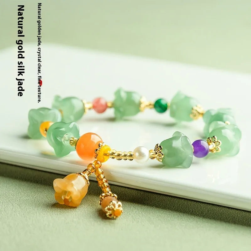 Natural Xinjiang Jinsi Jade bracelet with carved orchid beads in aventurine orchid colour.