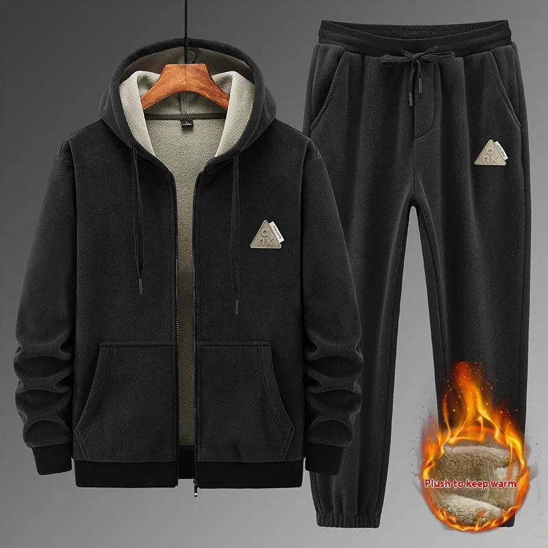 Grey cashmere-blend hooded sweater and matching trousers laid flat as a casual sports suit set.