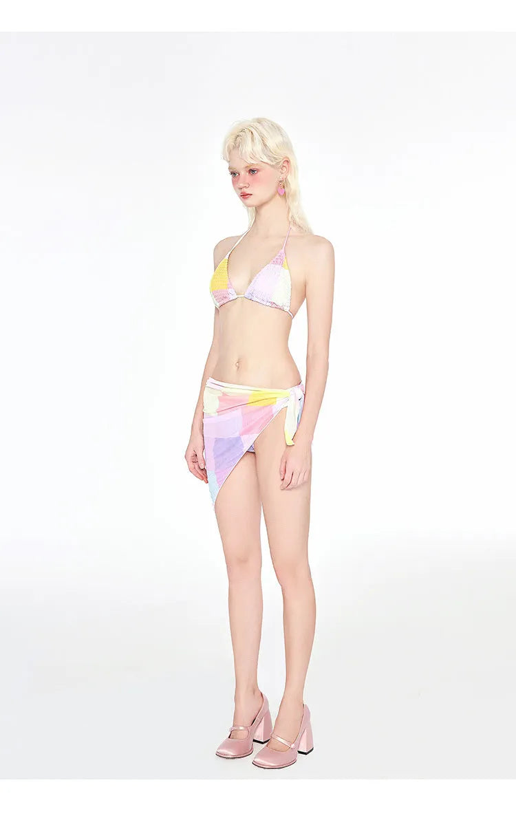 Rainbow pink women's triangle bikini three-piece swimsuit set on a mannequin.