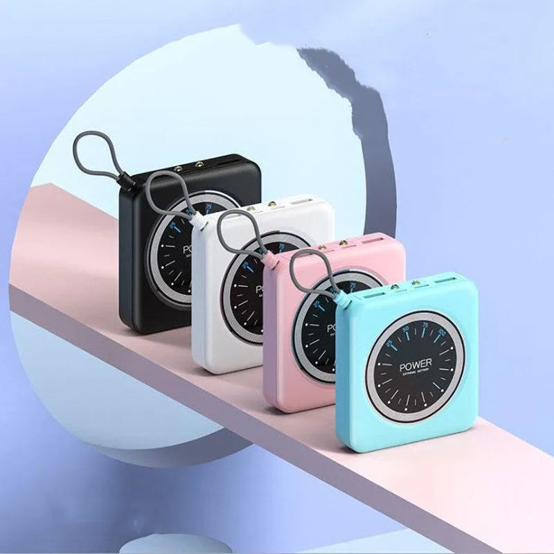 Compact alloy-cased portable power bank in mint green with multiple USB output ports on a white background.