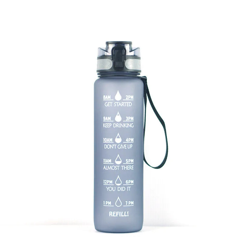 Transparent 1000ml plastic water bottle showing clear Tritan construction with visible liquid