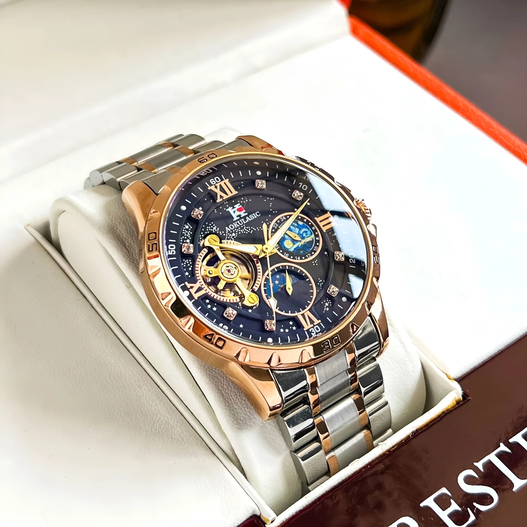 Men's rose gold and black automatic mechanical watch with a large 42mm dial on a leather strap