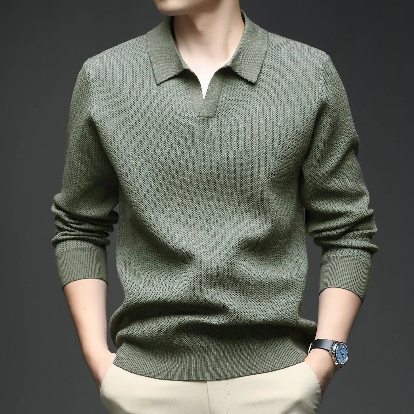 Men's loose-fitting casual pullover sweater in a polyester viscose nylon blend, shown in green.