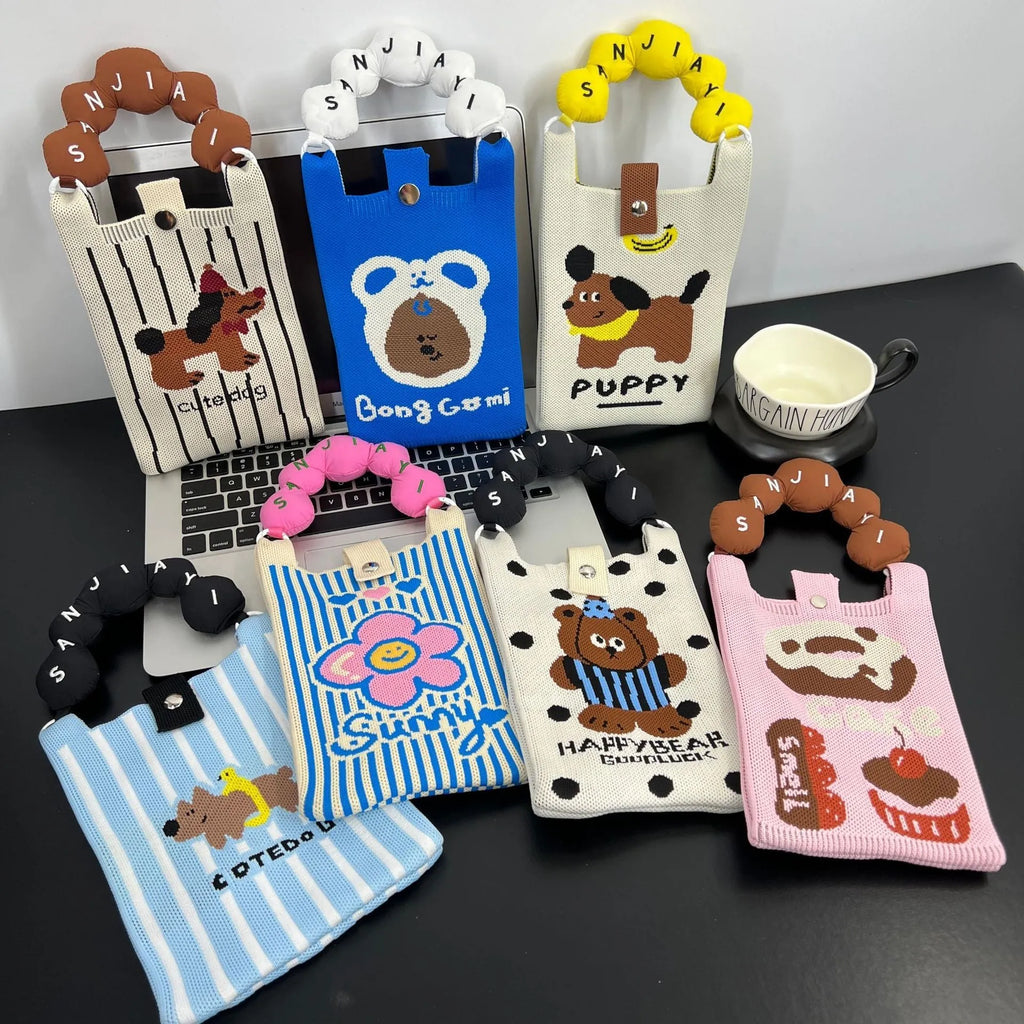 Square vertical cartoon knitted messenger bag with woven polyester construction and internal phone pocket