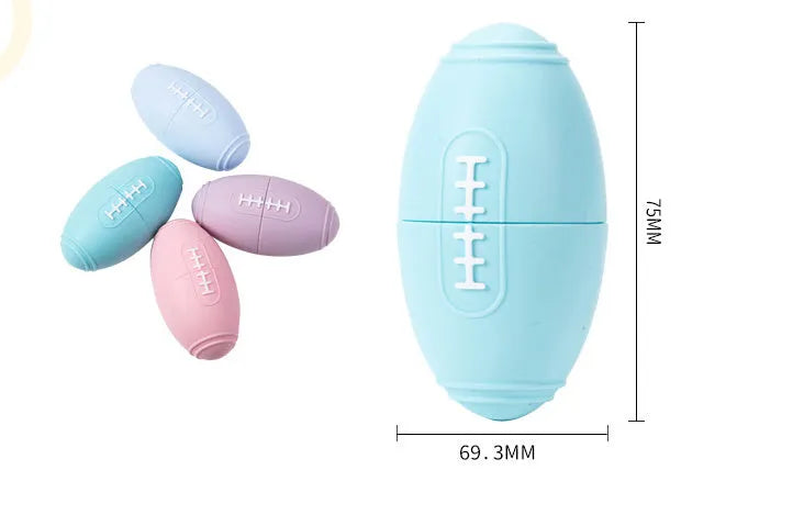 Blue silicone rugby ball dog toy with hollow treat compartment on a wooden floor