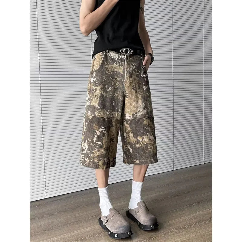 Yellow cotton jeans with a detailed snake pattern and camouflage print, featuring a cropped leg length.