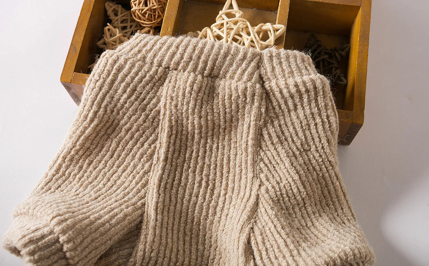 Brown knitted cloth sweater pullover on a small dog, showing casual style.