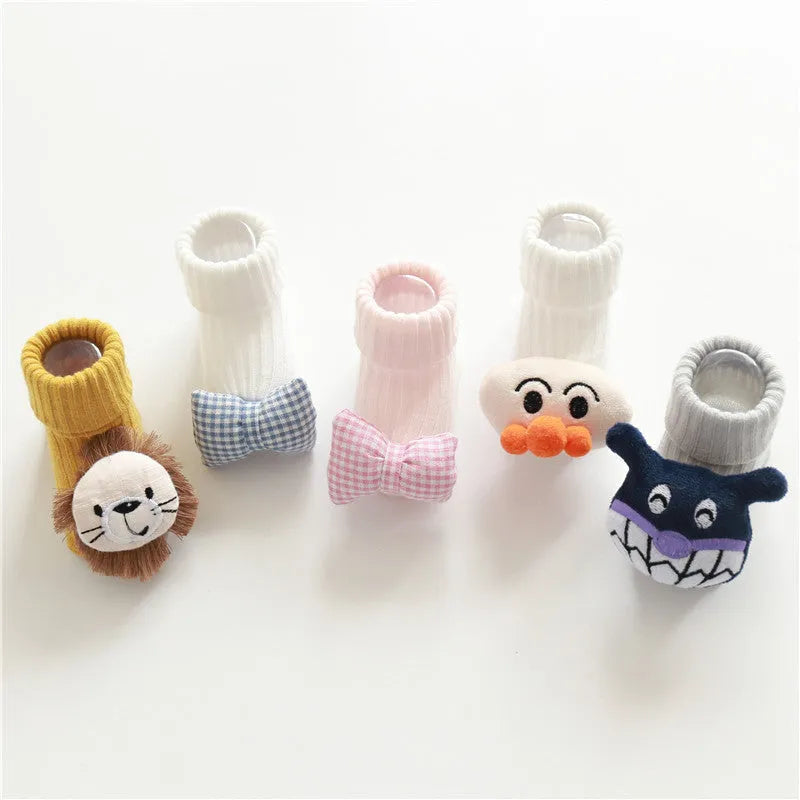 Cotton baby socks in various colours and patterns including bows, stars, and animal designs