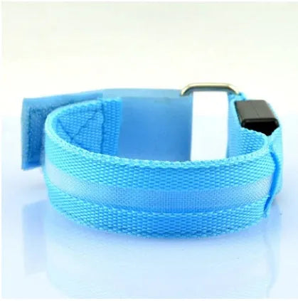 Illuminated arm band with LED lights on a black ribbon, adjustable, showing blue and red colours