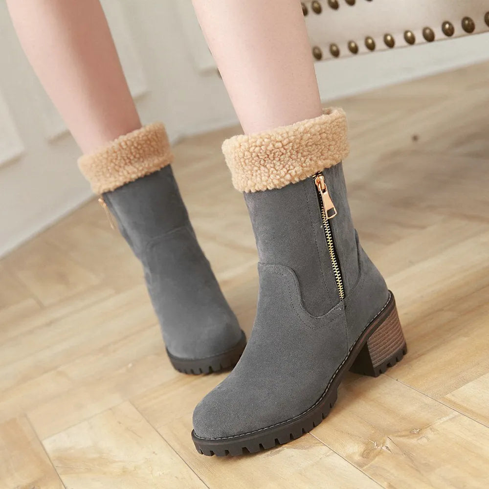 A pair of adult snow boots with plush lining, shown in one of the available colours: black, grey, green, or orange.