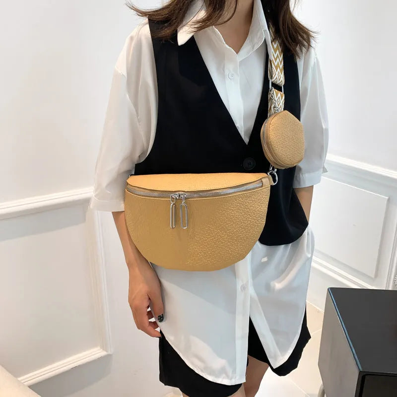 Women's solid colour PU crossbody bag with clamshell design and single shoulder strap.